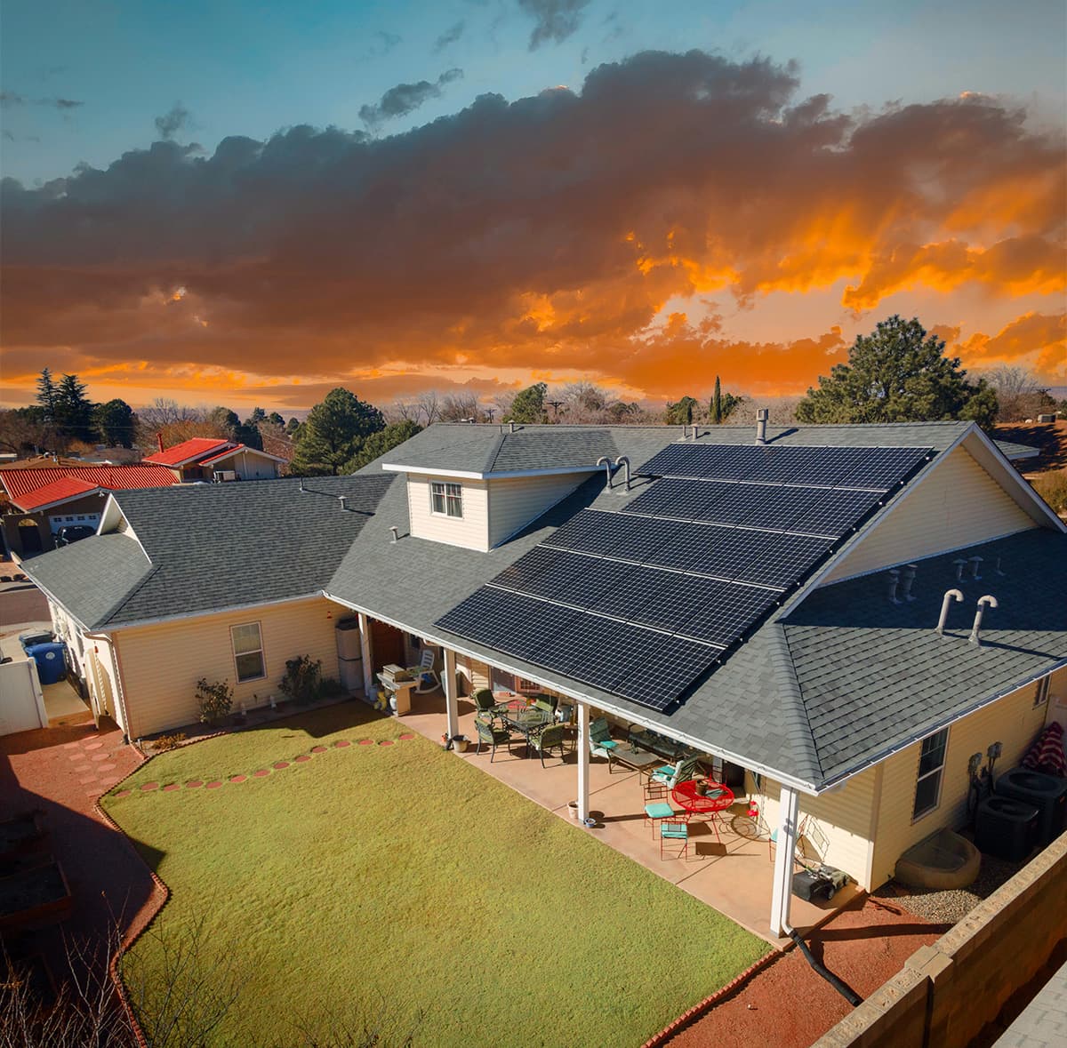 Aerial view of an Albuquerque home with solar panels at sunset, installed by Epex Home Performance